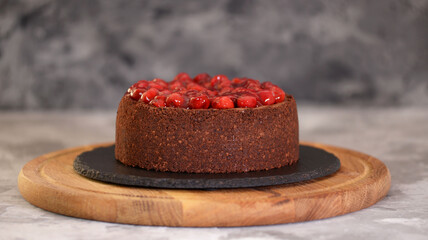 Delicious Homemade Chocolate Cheesecake Decorated With Cherry Sauce.
