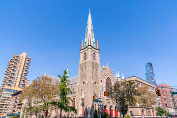Fototapeta premium The Holy Name of Jesus Roman Catholic Church is located at W96th St at the corner of Amsterdam Avenue Manhattan , New York City. The statue of Virgin Mary stands at the corner of Amsterdam Avenue.