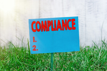 Handwriting text Compliance. Conceptual photo ability of an object to yield elastically when a...