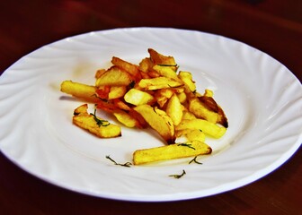 French fries on a white plate. concept of junk food, close-up
