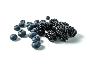 Blackberries and blueberries on white