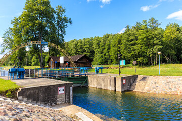 "Sluza Karwik" which translation is "Sluice in Karwik village" connecting Sniardwy Lake with Ros Lake, important for sailing on Masurian Lakes, Poland