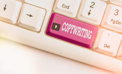 Word writing text Copywriting. Business photo showcasing writing the text of advertisements or publicity material Different colored keyboard key with accessories arranged on empty copy space - obrazy, fototapety, plakaty
