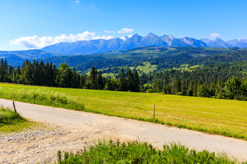Road at Lapszanka Pass and view of Tatra Mountains panorama on beautiful summer sunny day, Poland