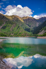 Fototapeta na wymiar Amazing view of a mountain lake in front of a mountain range, Almaty city national park, Kazakhstan