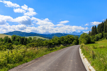Fototapeta na wymiar Cycling road from Osturnia to Kacwin village in Tatra Mountains on Poland Slovakia border on beautiful summer sunny day