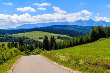 Fototapeta na wymiar Cycling road from Kacwin to Lapsze Nizne village in Tatra Mountains on beautiful summer sunny day, Poland