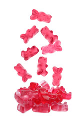 Delicious jelly bears falling on white background