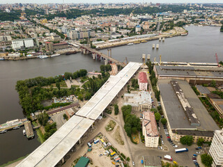Fototapeta premium Aerial drone view. Construction of a bridge across the Dnieper river in Kiev.