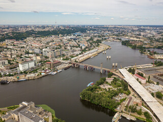 Fototapeta na wymiar Aerial drone view. Construction of a bridge across the Dnieper river in Kiev.