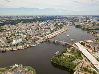 Aerial drone view. Construction of a bridge across the Dnieper river in Kiev.