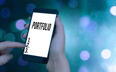 Conceptual hand writing showing Portfolio. Concept meaning securities held by an investor, paper...