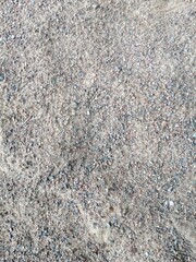 grey and brown background with fine gravel and sand.Natural wallpaper