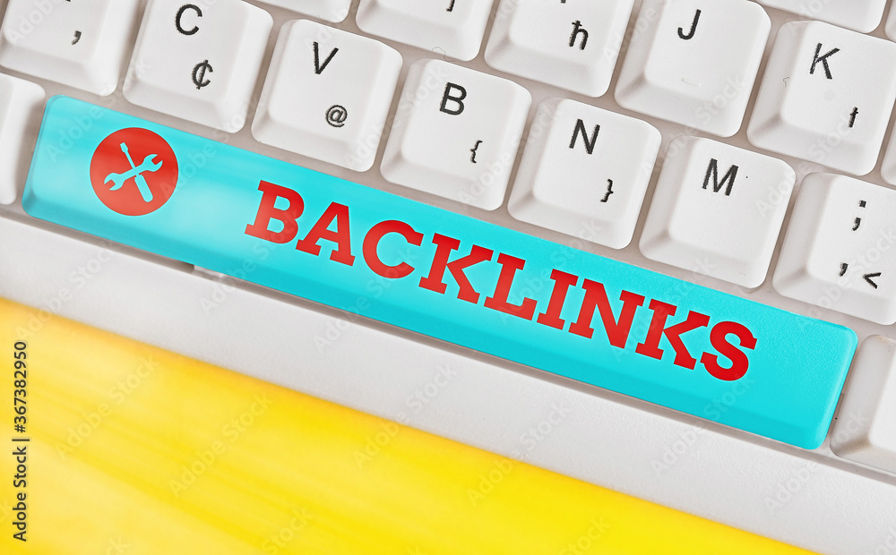 Poster Handwriting text Backlinks. Conceptual photo links from one website to a page on another website or page Different colored keyboard key with accessories arranged on empty copy space
