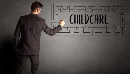 businessman drawing maze with CHILDCARE inscription, business education concept