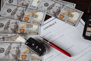 Contract form for purchase car with pen and money. Savings concept.