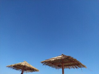 Reed bamboo dry roofs of summer  beach houses bungalows