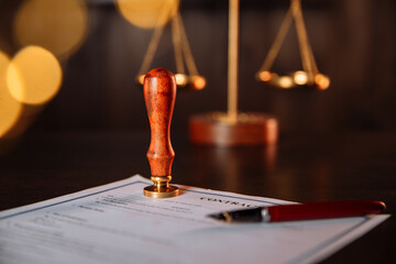 Notary's public pen and stamp on a contract in office. Notary public tools.