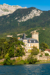 Fototapeta premium Annecy in France, the Duingt castle on the lake, and the Saint-Jorioz village 