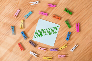 Writing note showing Compliance. Business concept for ability of an object to yield elastically...