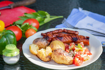 grilled sausage with baked potatoes