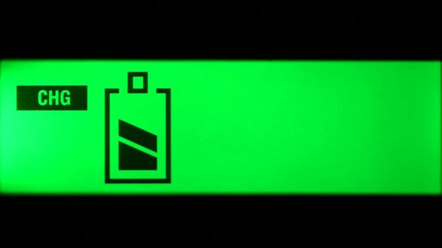 Close up of charger green screen with four battery charge level indicators appearing in sequence. 