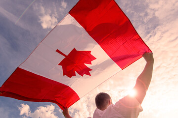 Man holding The National Flag of Canada 