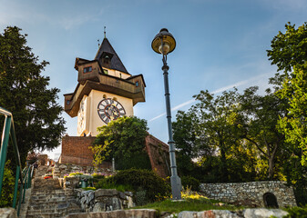 Fototapeta na wymiar The clock tower, Uhrturm in Graz City. Famous historic structure on summer day
