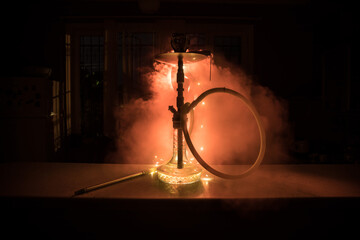 Hookah hot coals on shisha bowl with black background. Stylish oriental shisha. Shisha Concept
