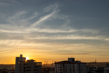 Fototapeta na wymiar sunrise or sunset over the city silhouette
