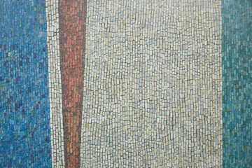 Detail of a beautiful old crumbling abstract ceramic mosaic decor.