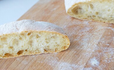 Homemade bread (baguette) on a wooden board