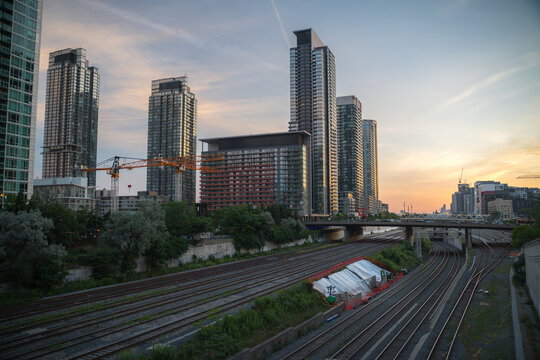 View of Urban Metropolitan City during Sunset with railway tracks and dense buildings