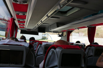 the interior of the passenger bus on the move, the passenger and seats, the passenger bus,
