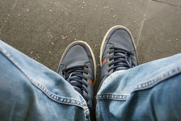 a person waiting for the departure time at the bus stop,