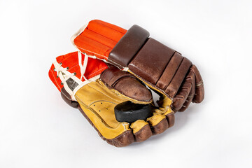 Old red hockey gloves for goalkeeper. Isolated over white background