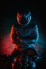 Foto op Plexiglas biker with black helmet and crossed arms at night and colorful lights © The Protograph