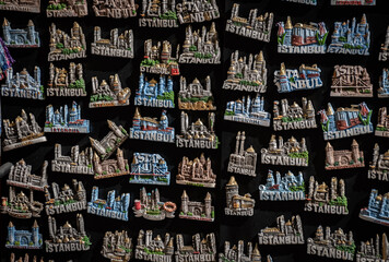 dozens of istanbul concepts magnet souvenirs on a black platform
