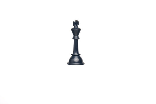 Levitation and King maker concept with chess black king on isolated white background.