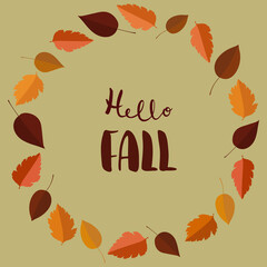 Hello fall hand drawn text surrounded with autumn leaves arranged into wreath. Postcard concept