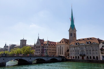 Fototapeta premium Panorama view of historic city center of Zurich with Fraumunster Church and Munsterbucke crossing river Limmat, Switzerland