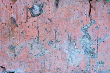 Red brick texture macro closeup, old detailed rough grunge textured copy space background, vertical grungy weathered stained vintage cracked backstein brickwork cut pattern.