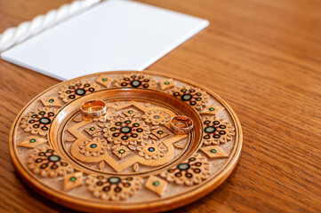 wedding rings on a wooden stand