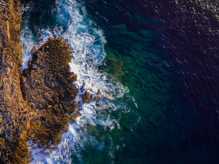 waves crashing on rocks
