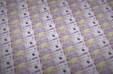 50000 Romanian leu bills printed in illegal money production conveyor. Collage of many fake bills....