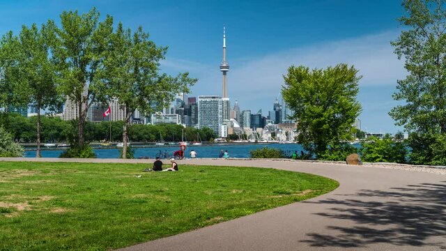 Toronto, Ontario, Canada, Daytime Timelapse View Of People Enjoying Summer At The Park With Iconic Toronto Skyline In The Background.