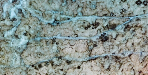 An aerial view of the beautiful Mediterranean sea, where you can se the rocky textured underwater corals and a flow or water that looks like an underwater river and the clean turquoise water of Cyprus
