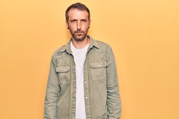Obraz premium Young handsome man wearing casual clothes skeptic and nervous, frowning upset because of problem. negative person.