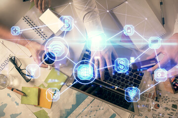 Double exposure of man and woman working together and social network theme hologram drawing. Computer background. connecting concept. Top View.