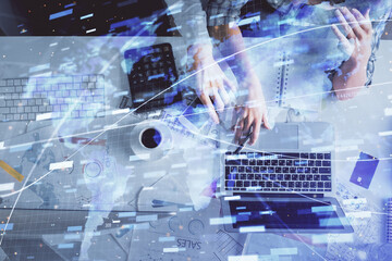 Double exposure of man and woman working together and data theme hologram drawing. Computer background. Top View.